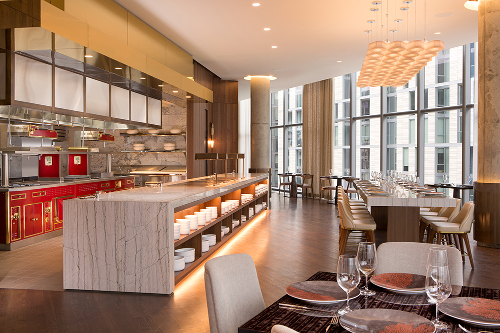 View of kitchen and bar from restaurant interior